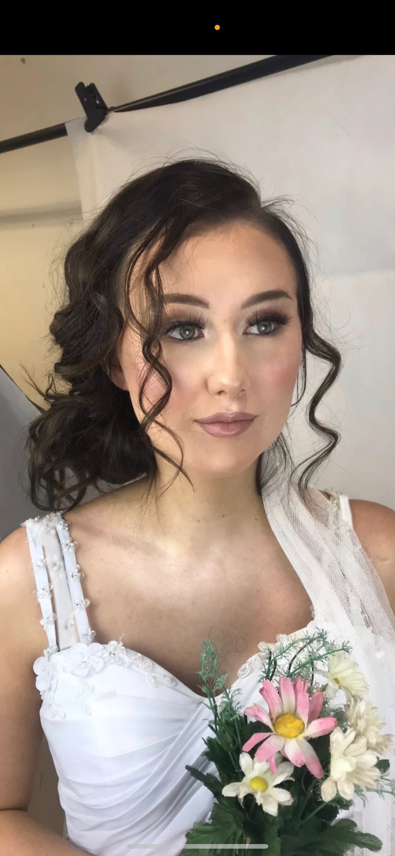 Bridal makeup with elegant curled updo