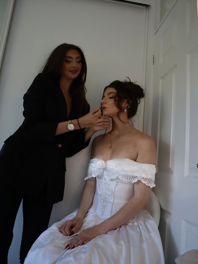 Millie applying makeup